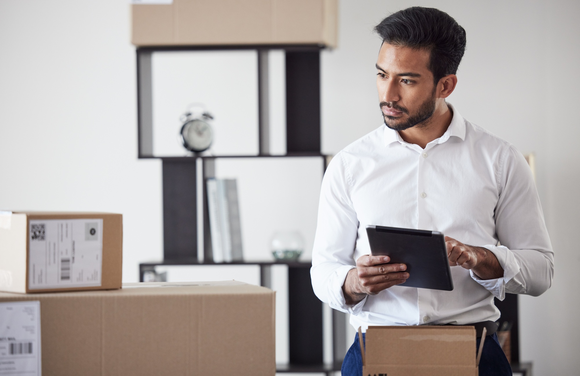 Tablet, box and business man for logistics startup for shipping, delivery and supply chain service.